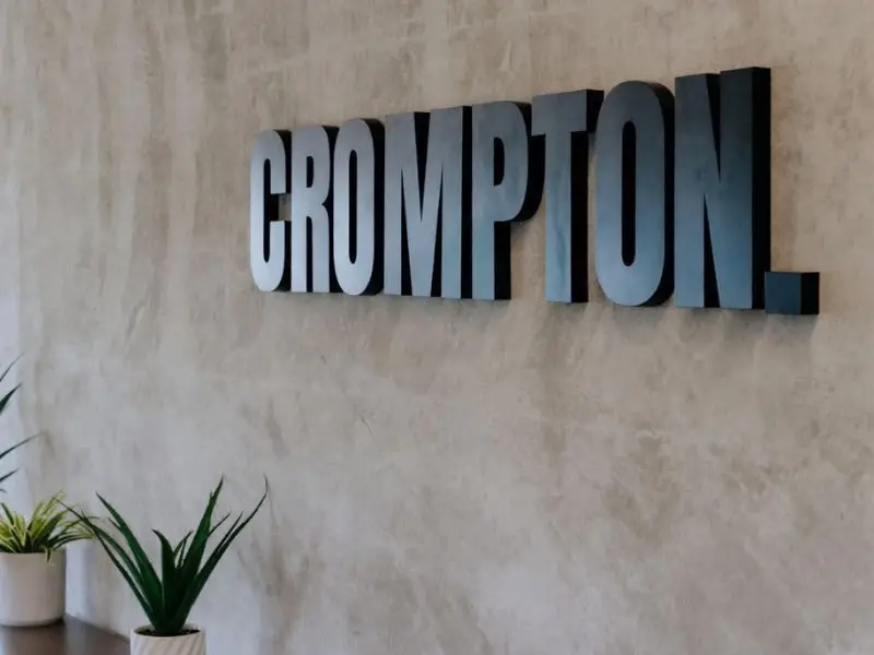 Crompton office interior wall signage with modern company branding