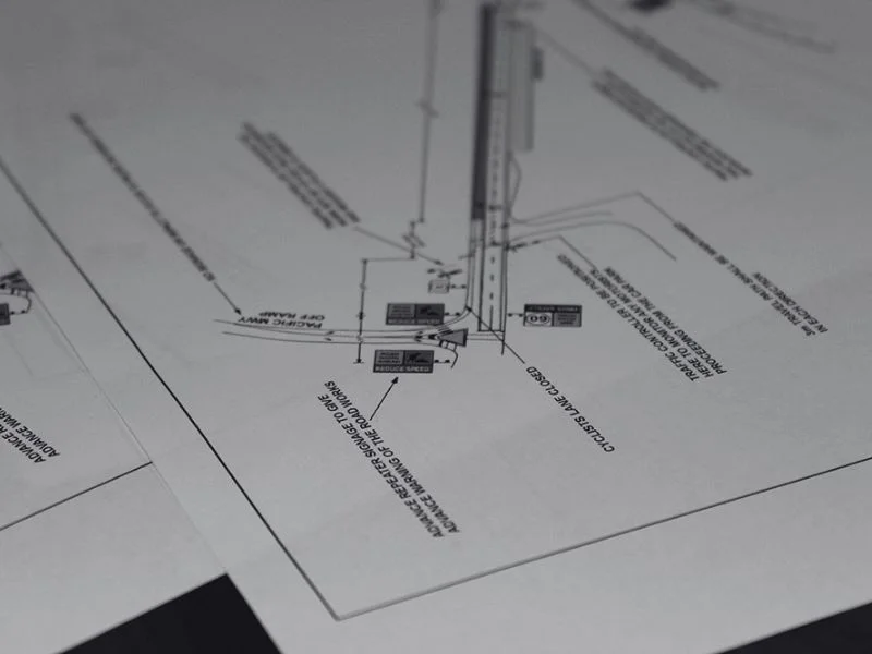 Traffic management engineering plan showing roadwork layout and traffic control details on printed document